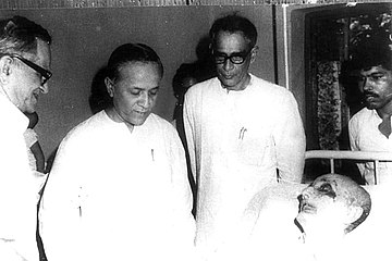 B. T. Ranadive, Jyoti Basu and Hare Krishna Konar. (In front of Communist Leader Muzaffar Ahmad at his last breath).