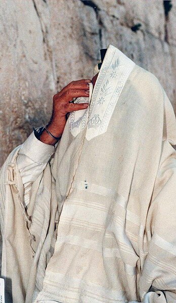 A white tallit according to some Sephardic traditions