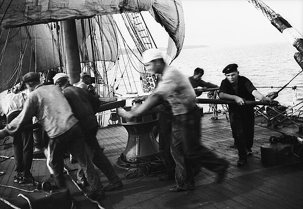Sailors working at a capstan