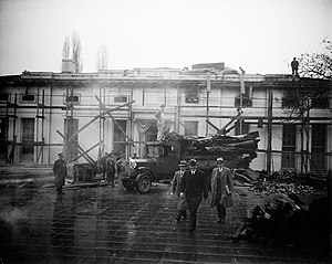 December 24, 1929: Electrical fire destroys the West Wing of the White House, rebuilding planned President Hoover views West Wing fire ruins 15 January 1930 cropped.jpg