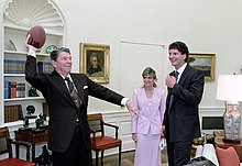 Kosar with U.S. President Ronald Reagan in the Oval Office in February 1987 President Ronald Reagan throwing a football during a photo op with football player Bernie Kosar of the Cleveland Browns.jpg