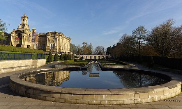 Reflection of of the sky and Cartwright Hall in the circular pool