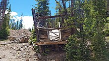 Remains of an abandoned mine's ore bin along the Million Dollar Highway between Durango & Silverton Remains of an Abandoned Mine's Ore Chute near Silverton, Colorado.jpg