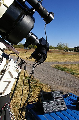 Spectrography setup with autoguider (the autoguider camera body is attached to the finderscope, top right, and the guiding computer, bottom right). Spectrography setup, showing autoguider (8186292276).jpg