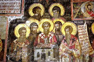 Medieval icon by Kostandin and Athanas Zografi in the Monastery of Ardenica. It illustrates the seven saints Clement, Naum, Sava, Angelar, Gorazd, Cyril, Method and the Albanian Jan Kukuzeli. Sv Sedmocislenici with Jovan Kukuzel in Ardenica.jpg