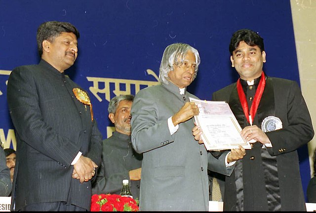 A. P. J. Abdul Kalam presenting the Best Music Direction Award for the year 2002 to A. R. Rahman for the Tamil film Kannathil Muthamittal.