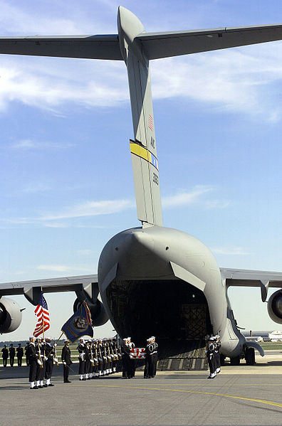 File:The United States Navy Ceremonial Guard honors fallen members from USS COLE (DDG 67) at Dover Air Force Base, Delaware, as their remains are removed from a US Air Force C-17 Globemaster III aircraft on October 001014-F-XH957-002.jpg