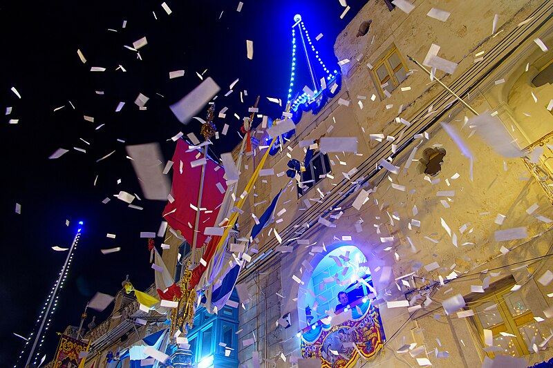 File:Throwing Confetti, Tarxien Feast, 2023.jpg