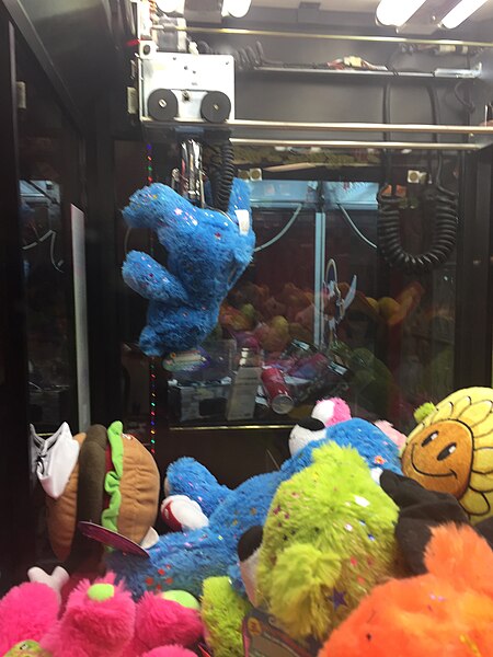 File:Toy stuck on claw machine.jpg