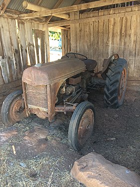 This old tractor is in a dilapidated barn on a Placerville, California farm.