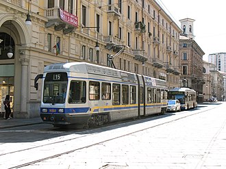 City tram, bus can be seen behind Tram in Torino, Italy.jpg