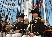 Officers and crew of USS Constitution (2005) US Navy 050730-N-0335C-002 U.S. Navy Cmdr. Thomas C. Graves and Executive Officer Lt. Brad Coletti look on during USS Constitution change of command ceremony.jpg