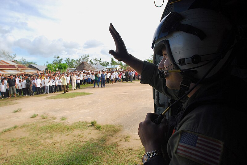 File:US Navy 080701-N-0640K-191 Aviation Warfare Systems Operator 2nd Class Jeremy Thomas, a native of Warren, Ohio, waves to citizens of the Municipality of Balasan, Philippines after delivering hygiene items, water and tents to th.jpg