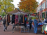 View on the flea market Waterlooplein with second hand clothes stables; free photo Amsterdam city by Fons Heijnsbroek, 12-10-2021