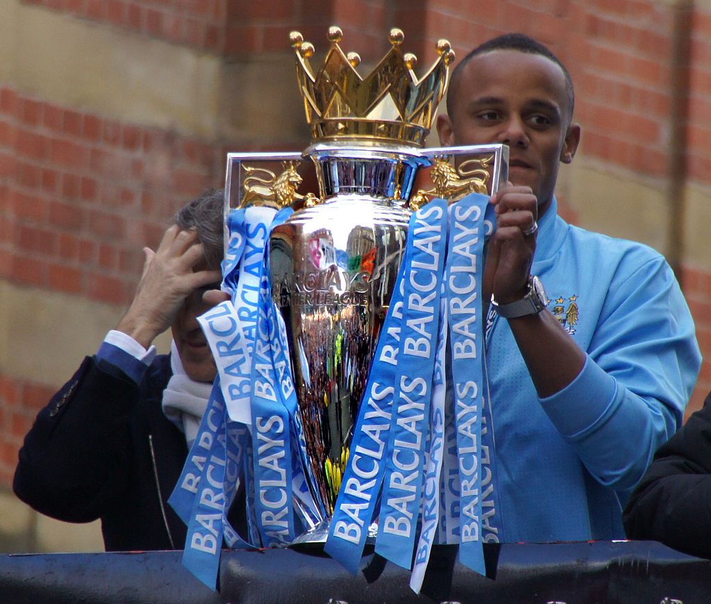 Vincent Kompany holds up the Premier League trophy 2012