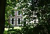 Rechthoekig landhuis, houten deuromlijsting