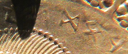 The name Wōđnas on a bracteate from the early 5th century AD written as a mirrored text