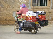 A typical door-to-door vendor in rural Zhangpu County, Fujian, China. Xidan - vendor - P1260053.JPG