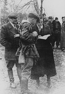 Clockwise are Roman Shukhevych, Dmytro Hrytsai and Catherine Miechko-Lagouch in November 1943, shortly before the penultimate phase of massacres of Poles in Volhynia and Eastern Galicia 1307438718 arxivcdvr sh00050.jpg