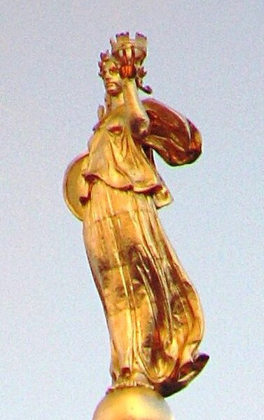 The gilded statue of Civic Fame at the top
