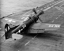 An AM-1Q of VC-4 prepares to take off from Kearsarge in 1949. The spirals are formed by wingtip vortices from the propeller blades.