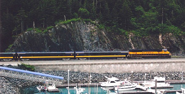 Alaska Railroad passenger train leaving Whittier towards the tunnel