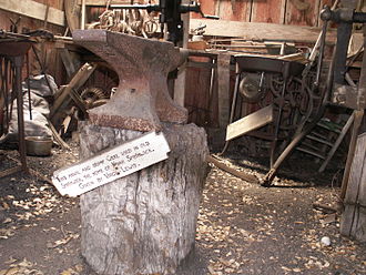 Anvil and stump from Smithwick Mills, home of Noah Smithwick, early fort blacksmith Anvilstump.JPG