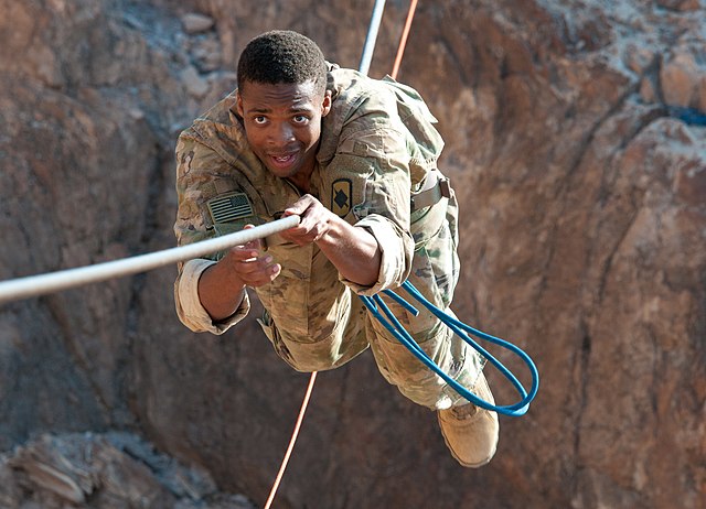 2nd Lt. Kre McMahon, of the Arkansas National Guard, completes the mountain obstacle portion of the French Desert Commando Course in Djibouti, Africa