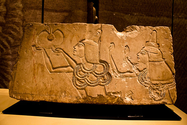 A stone block shows Ay receiving the "Gold of Honor" award in his Amarna tomb from Akhenaten.