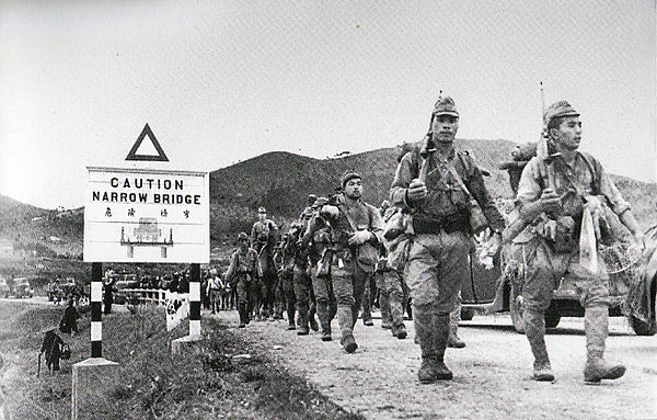 Japanese troops crossing the border from the mainland, 1941