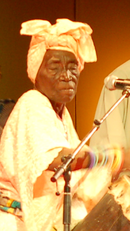 Bi Kidude (1910s-2013) was a Zanzibari-born Tanzanian Taarab singer. She has been called the "queen of Taarab and Unyago music." Bi Kidude.png