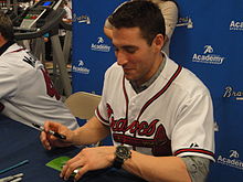 Starting pitcher Brandon Beachy signing autographs at a 2012 Braves Country Caravan appearance. BrandonBeachy2012.JPG