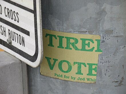 Remnant of Whittaker's campaign bumper sticker, photographed on a light pole on South Cushman Street in Fairbanks in 2014.  The bumper sticker read "Tired of Ted?  Vote for Jed!".