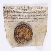 Acte de confirmation du roi Louis VI le Gros, scellé d'un sceau plaqué de cire brune, 1118. Archives nationales AE-II-132.