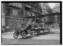 The sole Curtiss S-1 mounted on a truck for an Independence Day parade in New York City Curtiss S-1 - 4th July LCCN2014707556.tiff