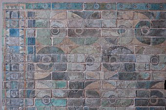Glazed siliceous bricks with a decorative spirals pattern, from palace of Darius the Great at Susa, currently in the Louvre, France.