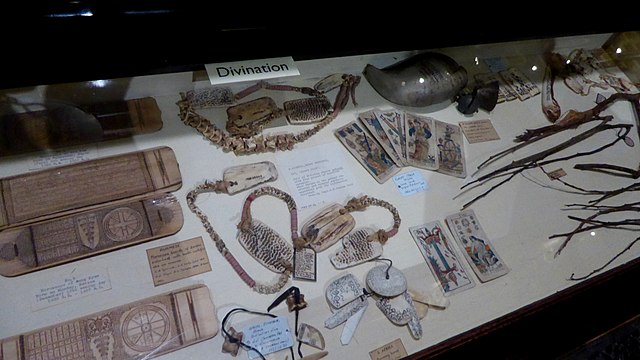 Display on divination, featuring a cross-cultural range of items, in the Pitt Rivers Museum in Oxford, England