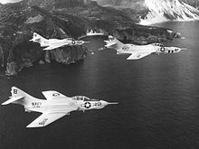 Two F9F-8Bs from VA-192 and an F9F-8P of VFP-61 over Formosa (Taiwan), in 1957 F9F Cougars of VA-192 and VFP-61 over Formosa 1957.jpg