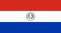 The flag of Paraguay, a charged horizontal triband.