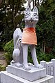 Fox statue at the shrine to Inari at the Ikuta Shrine.