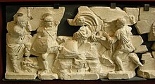 Fragmentary Augustan-era relief depicting the punishment of Tarpeia, a Vestal who in Roman legend broke her vows and betrayed her country by consorting with the enemy Fregio storico della basilica emilia, I secolo a.c., punizione di tarpea.JPG