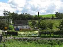 Poster outside village school in Gilsland, referring to an Ofsted inspection report Gilsland C.E. Primary School Is 'OUTSTANDING'.JPG