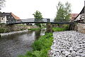 Deutsch: Großschönau (Sachsen), Fußgängerbrücke über Mandau. English: Großschönau (Sachsen), Footbridge over Mandau River. Čeština: Großschönau (Sasko), ocelová lávka přes Mandavu.