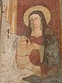 L'affresco della Madonna del Latte sulla parete destra della chiesa.