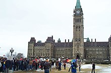 The March of Hearts rally in support of same-sex marriage at Parliament Hill in 2004. Same-sex marriage was legalized in 2005 with the passage of the Civil Marriage Act. March of Hearts crowd on Parliament Hill 2004.jpg