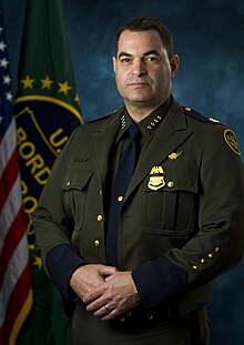 Former Chief of the U.S. Border Patrol Michael J. Fisher wearing the Border Patrol's version of the Ike jacket with peaked lapel Michael Fisher.jpg