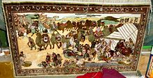Modern carpet illustrating a camel caravan on the Silk Road Moden carpet illustrating camel caravan on Silk Road. Kashgar.jpg