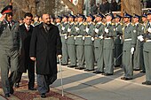 Interior Minister Mohammad Hanif Atmar passing by Afghan National Police honor guards shortly before he stepped down after the NCPJ Mohammad Hanif Atmar with ANP in 2010.jpg