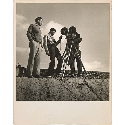 Dorothea Lange photograph of Paul Ivano, beside the camera at center, and documentary film pioneer Pare Lorentz, at left, in October 1935, near Bakersfield, California, at work on The Plow That Broke the Plains.