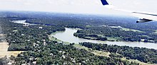 The airport was constructed right by the Periyar river seen from a landing plane. Periyarfromplane.jpg